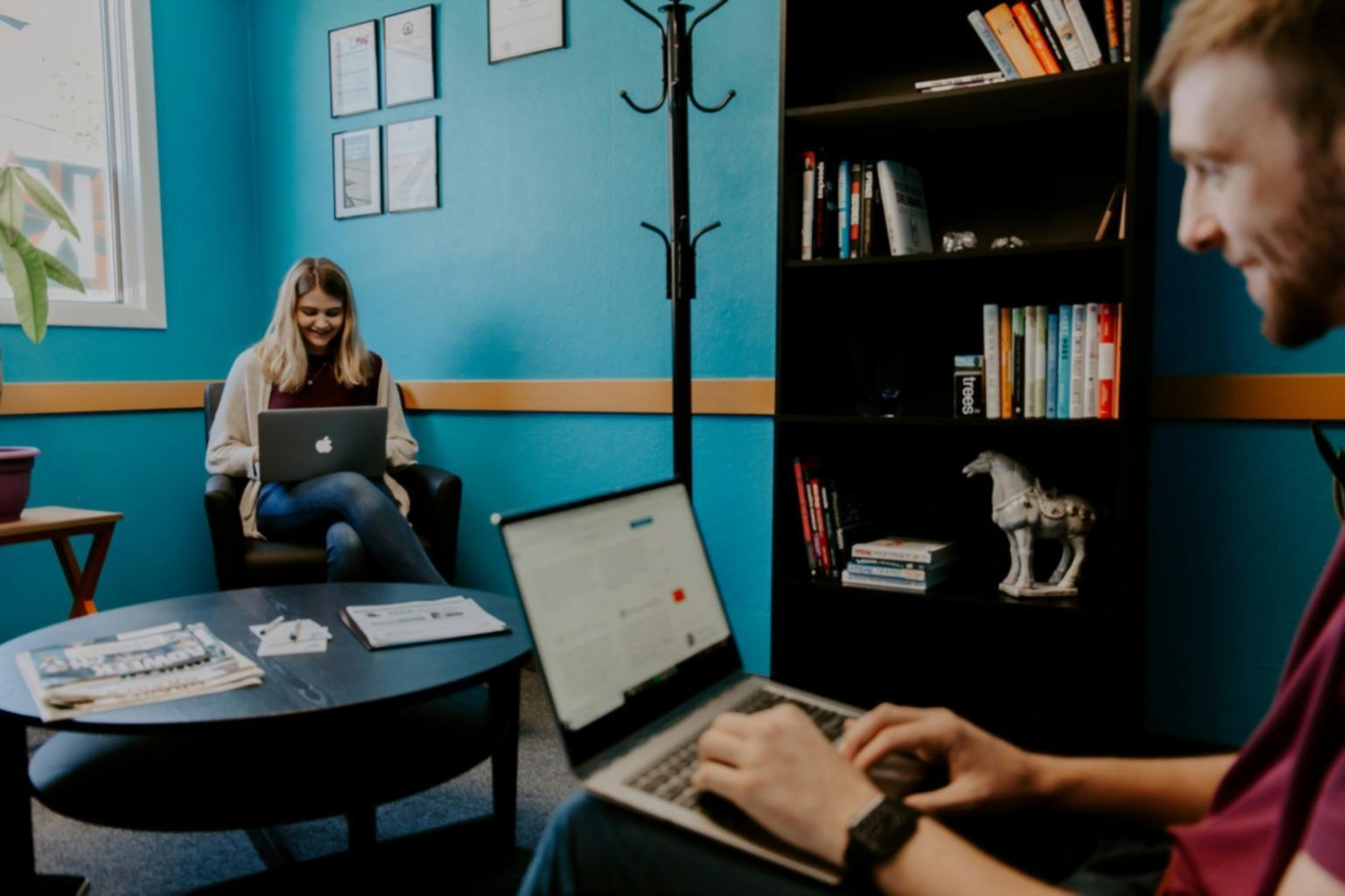 Mobile app testing workspace showing multiple devices and debugging tools in Bangkok office environment